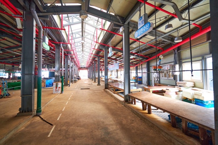 Roofed aisle and empty stalls inside Goseong Five-Day Market